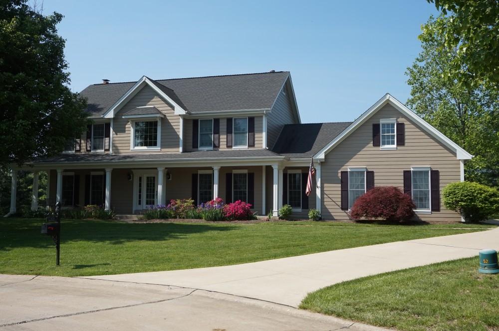 Photo By STL Siding Pros. Khaki Brown James Hardie Siding