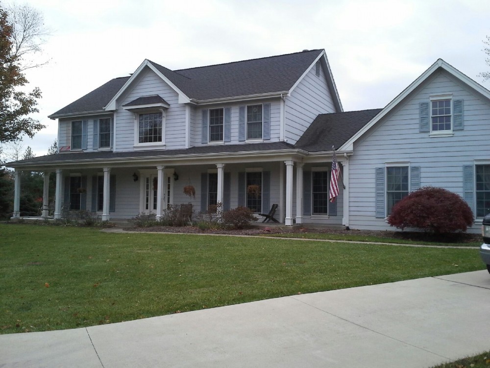 Photo By STL Siding Pros. Khaki Brown James Hardie Siding