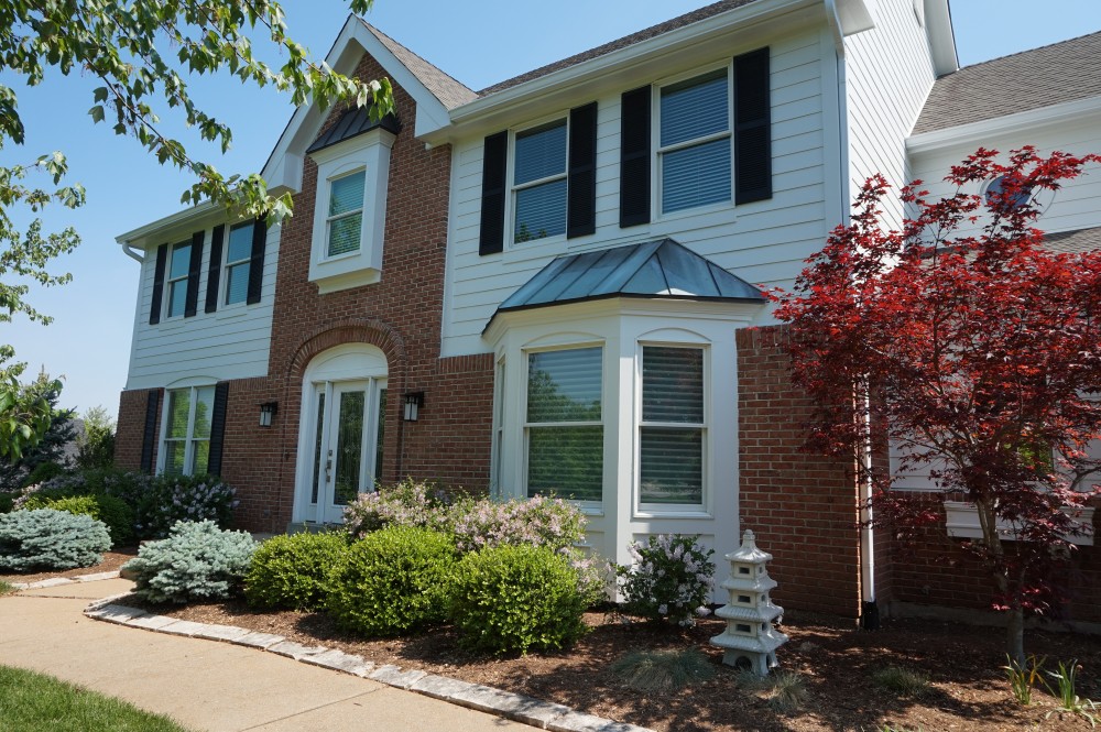 Photo By STL Siding Pros. Arctic White James Hardie Siding