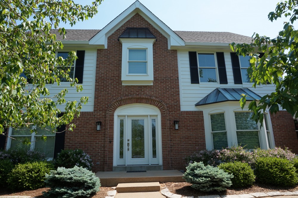 Photo By STL Siding Pros. Arctic White James Hardie Siding