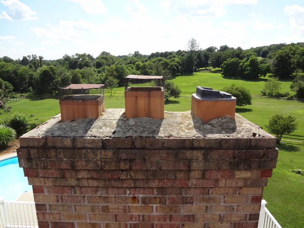 Photo By BRAX Roofing. Chimney Crown.