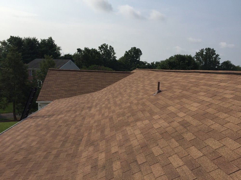 Photo By BRAX Roofing. Chimney Crown.