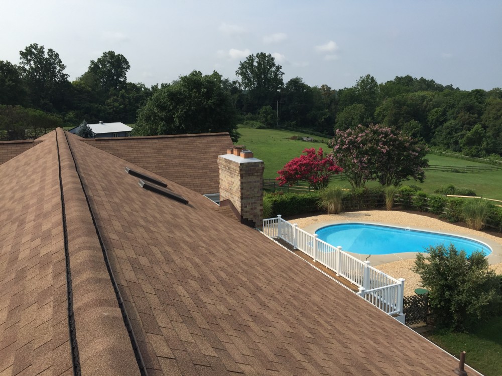 Photo By BRAX Roofing. Chimney Crown.