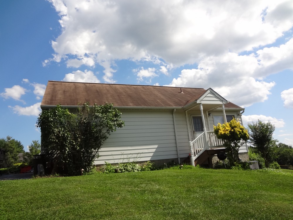 Photo By BRAX Roofing. Chimney Crown.