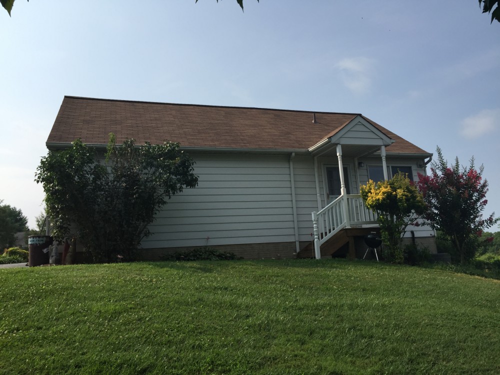 Photo By BRAX Roofing. Chimney Crown.