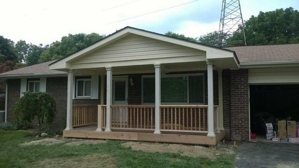 Photo By Ohio Exteriors. Covered Porch With Self-Closing Gates