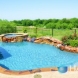 Photo by Hauk Custom Pools, LLC. Hauk Custom Pools Formal Geometric Designs - thumbnail