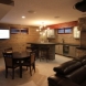 Photo by Total Home Inc.. Luxury Basement Bar - thumbnail