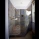 Photo by Golden Rule Creative Remodel. Sky and Stone Bath - thumbnail