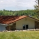 Photo by Allstar Construction. Corten steel corrugated metal roof on boat house - thumbnail