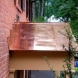 Photo by BRAX Roofing. Copper roof over front door  - thumbnail