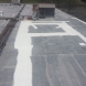 Photo by BRAX Roofing. New silicone roof coating for flat roof.  - thumbnail