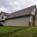 Photo by STL Siding Pros. Cobblestone James Hardie Siding with Arctic White Trim - thumbnail