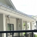 Photo by RGS Exteriors. Custom Aluminum 1/2 round seamless gutter - thumbnail