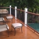 Photo by All American Exteriors. Timbertech Decking, Rails, Stone & Cedar Columns - thumbnail