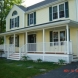 Photo by Care Free Homes Inc.. Farmer's Porch Addition - thumbnail