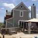 Photo by Ohio Exteriors. Mastic Board & Batten vinyl siding in Harbor Gray  - thumbnail