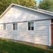 Photo by Moss Roofing. Insulated Siding Before and After - thumbnail